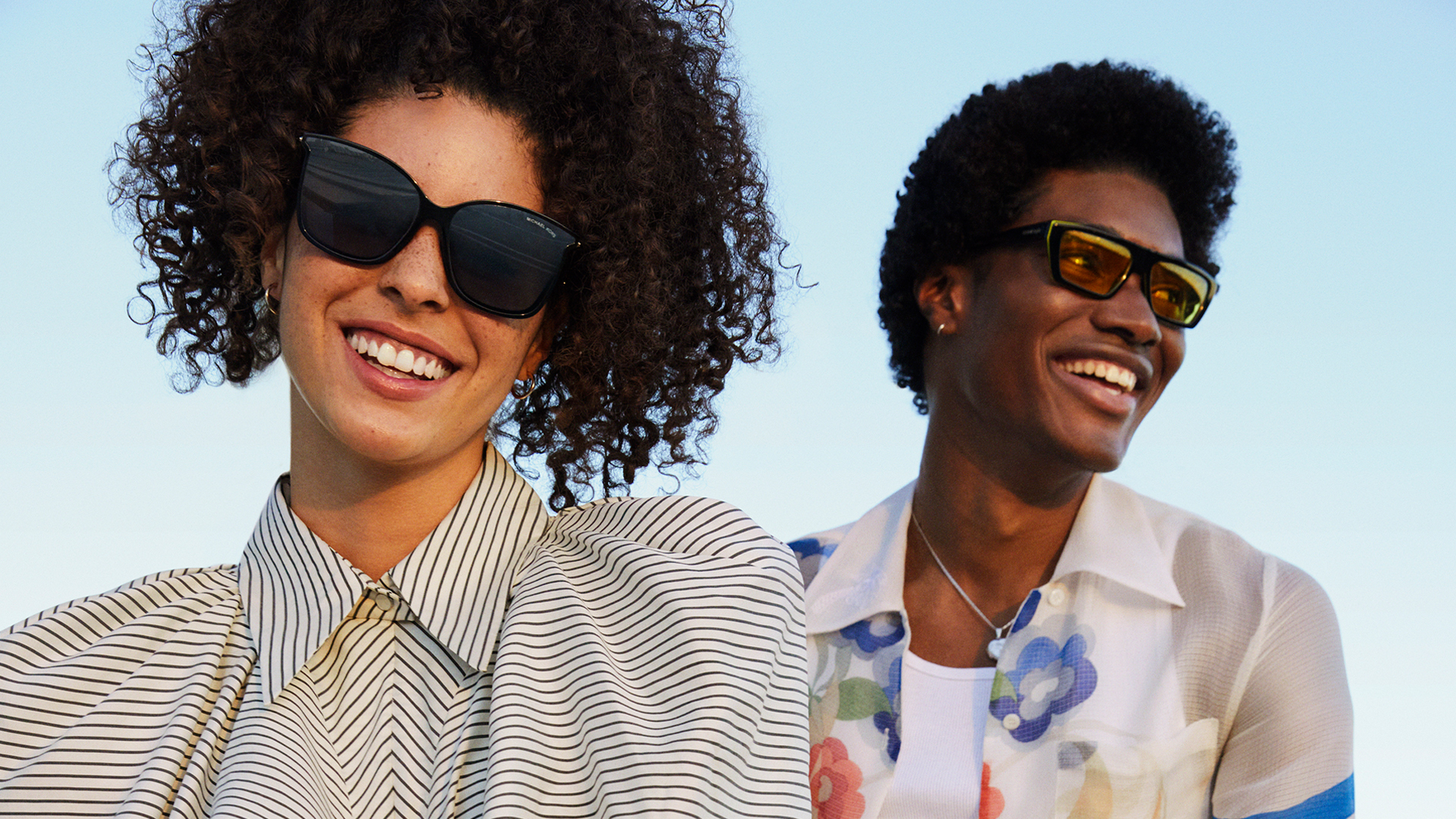 Man and woman wearing a Sunglass Hut sunglasses